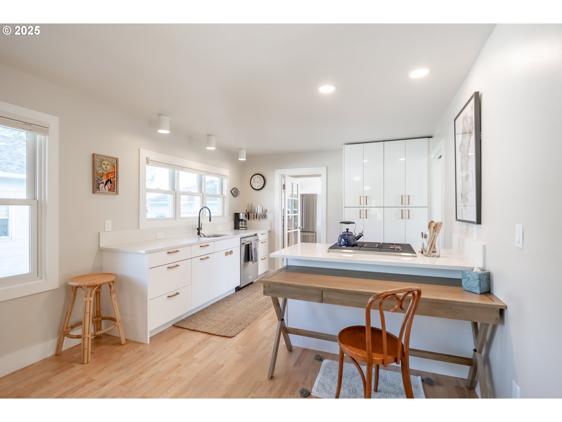 206 East 5th Street Newberg, OR 97132 - Photo 12 of 48 a kitchen with kitchen island a sink table and chairs