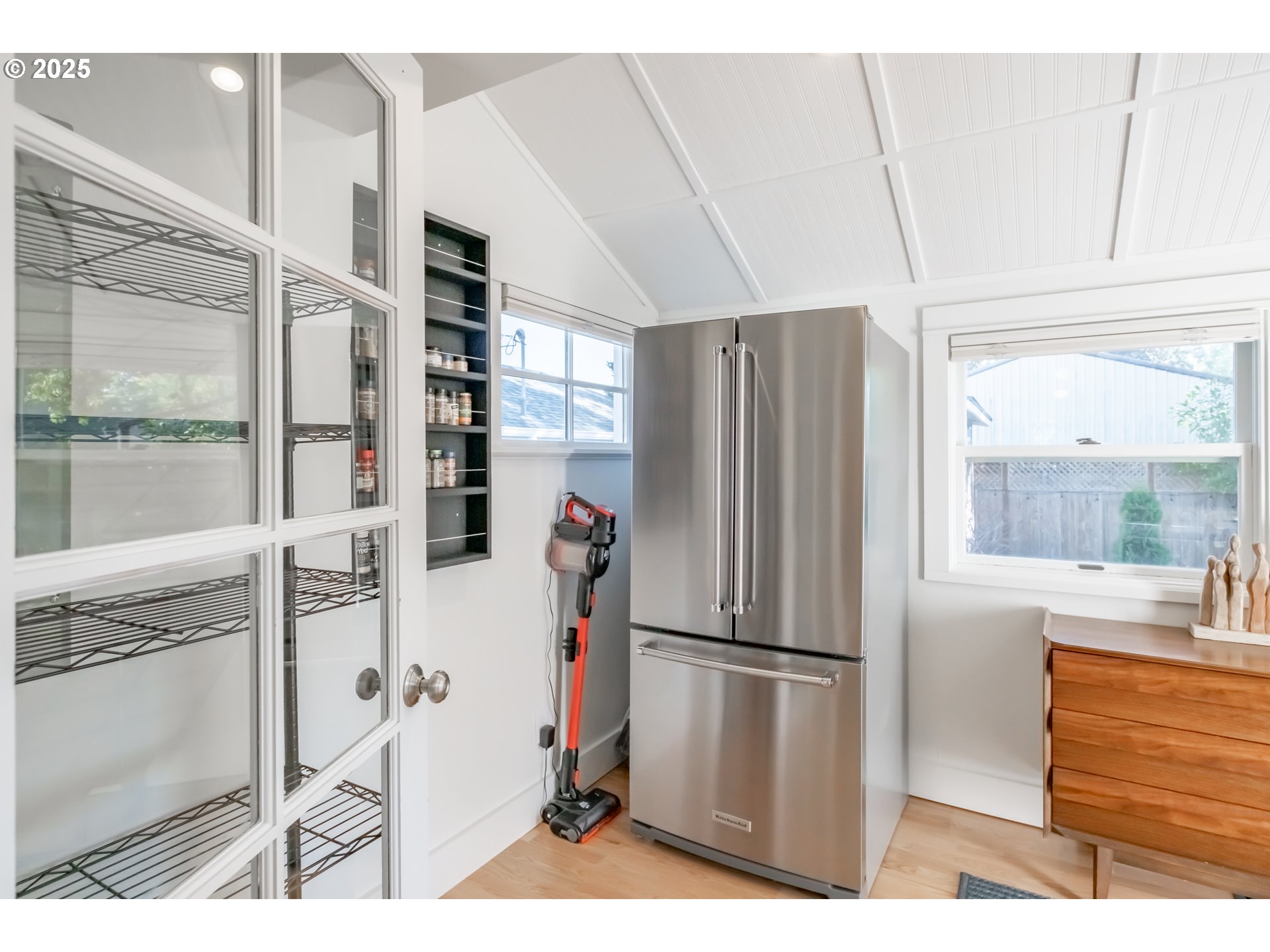 206 East 5th Street Newberg, OR 97132 - Photo 18 of 48 a kitchen with stainless steel appliances a refrigerator and a stove top oven
