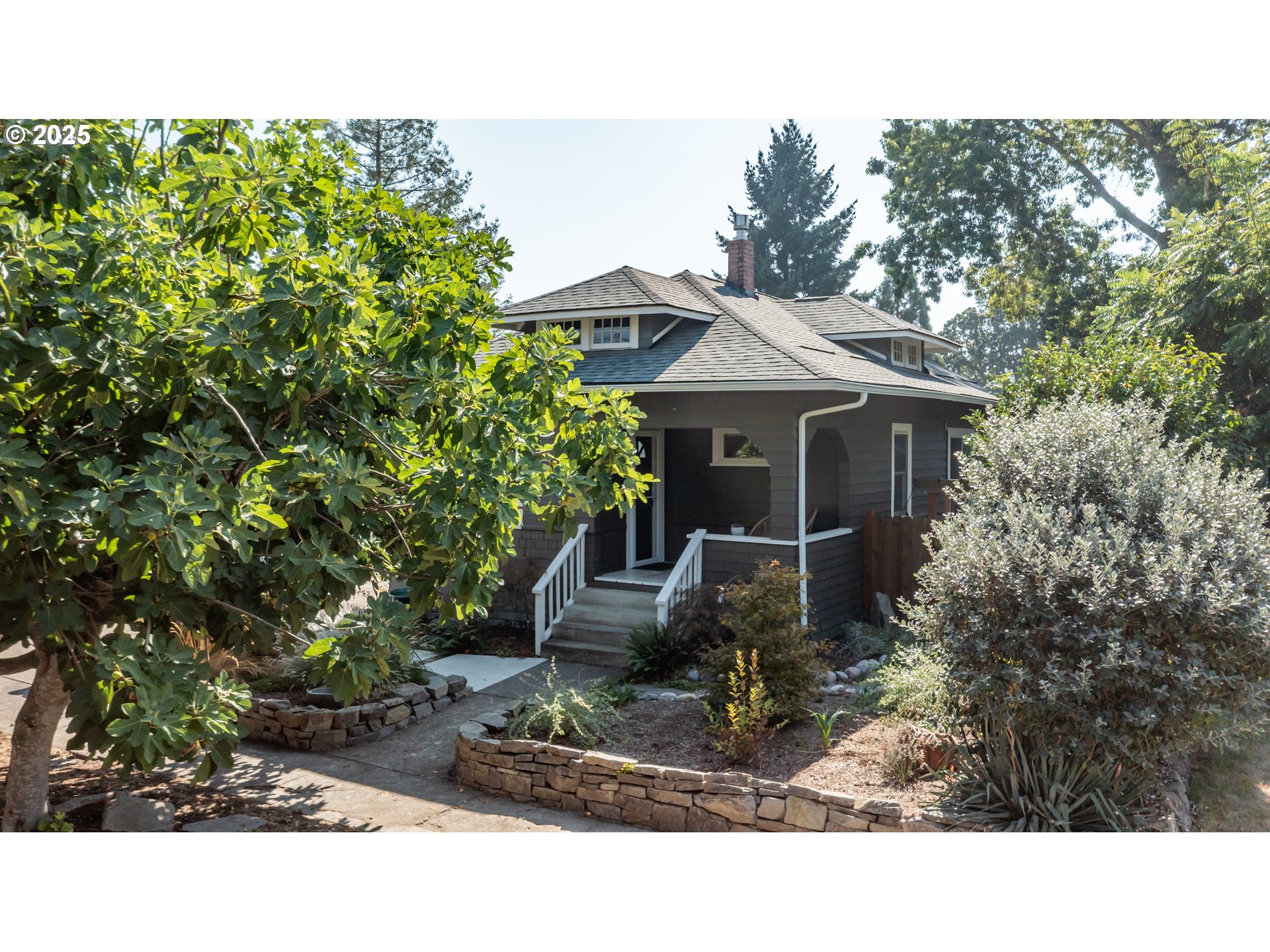 206 East 5th Street Newberg, OR 97132 - Photo 2 of 48 a house view with a garden space