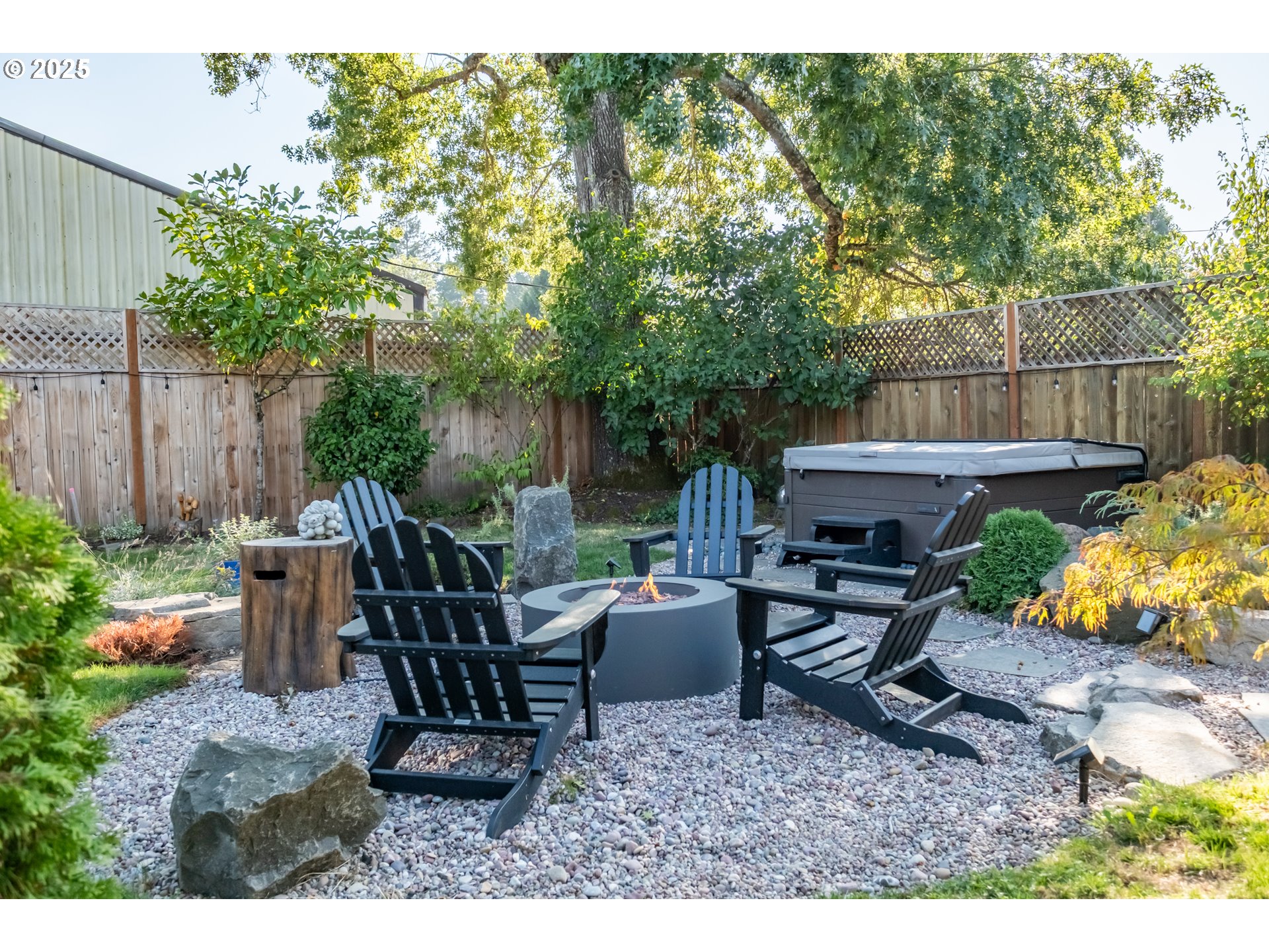 206 East 5th Street Newberg, OR 97132 - Photo 36 of 48 a view of a backyard with sitting area furniture and potted plants