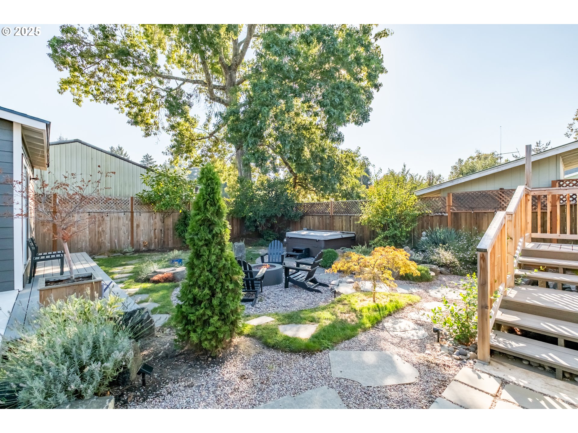 206 East 5th Street Newberg, OR 97132 - Photo 38 of 48 a backyard of a house with table and chairs