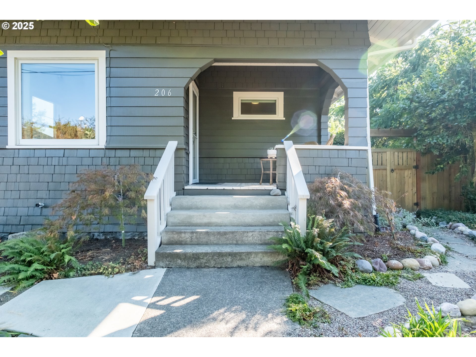 206 East 5th Street Newberg, OR 97132 - Photo 4 of 48 a front view of a house with a yard