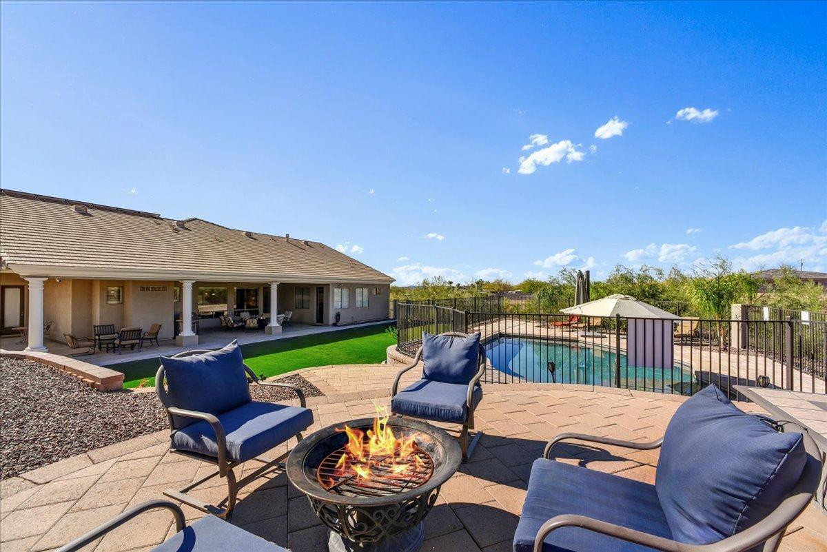 412 East Yearling Road Phoenix, AZ 85085 - Photo 2 of 51 a view of a patio with a table chairs and a patio