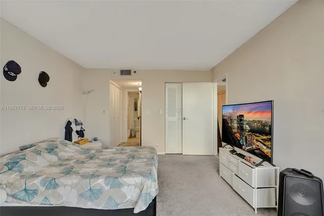 a bathroom with a sink double vanity and a toilet