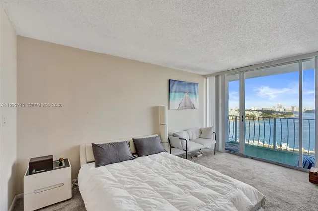 a bedroom with a bed and a cabinets