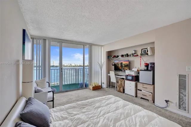 a bedroom with a bed and a chair