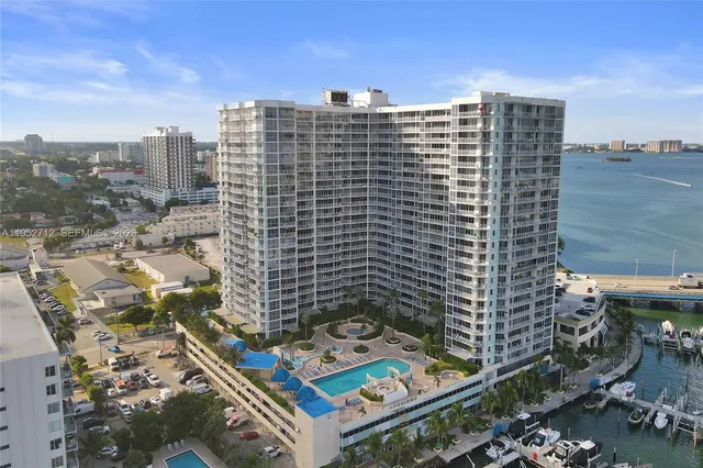 a kitchen with stainless steel appliances granite countertop a refrigerator stove a sink dishwasher and a refrigerator