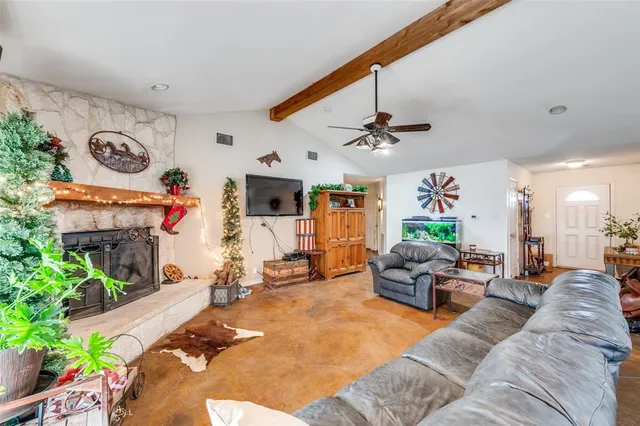 a kitchen with granite countertop stainless steel appliances a sink cabinets and a window