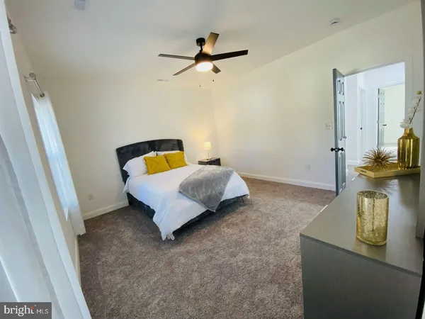 a view of empty room with ceiling fan
