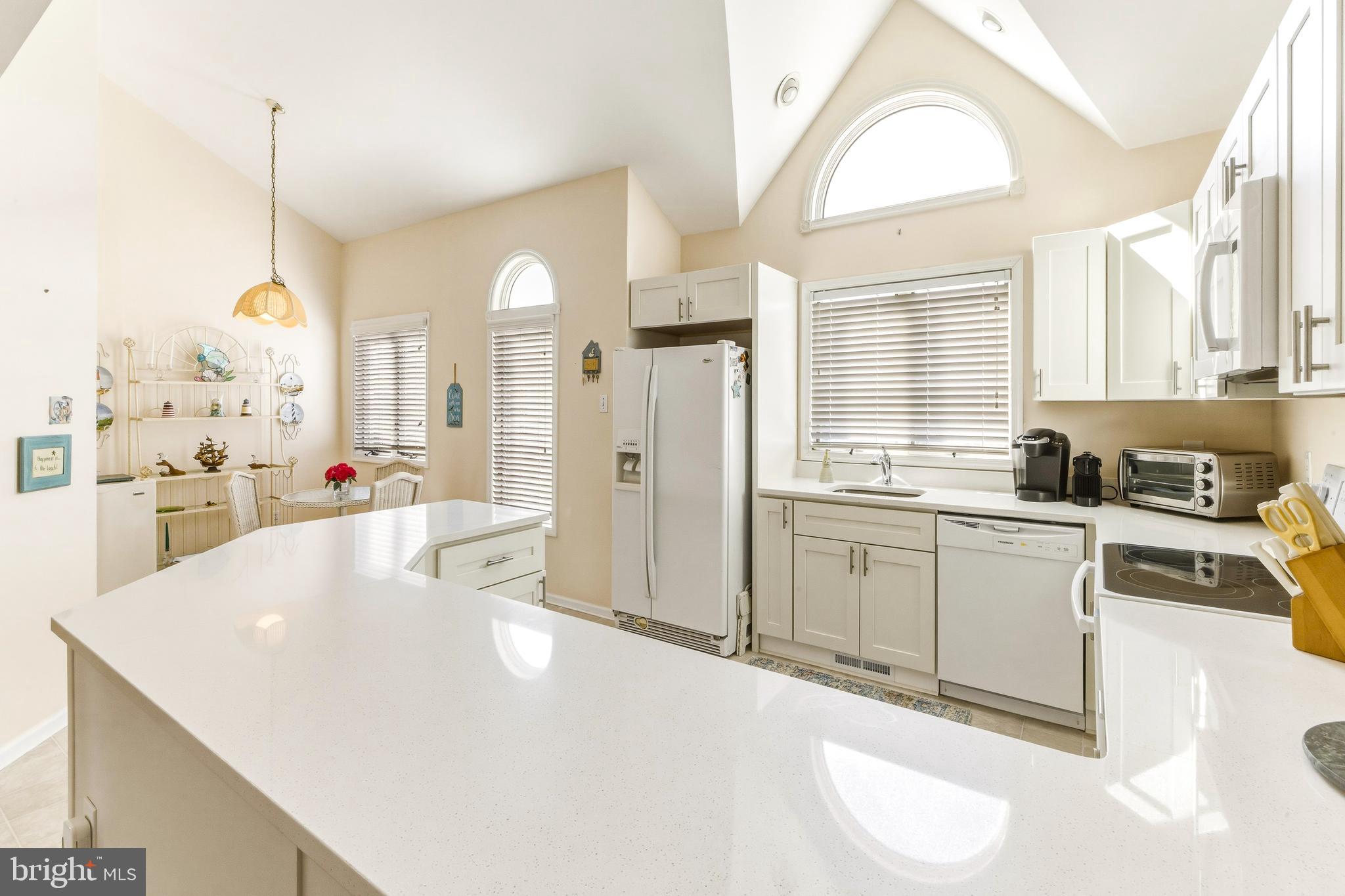 301 Gull Cove Brigantine, NJ 08203 - Photo 13 of 40 a large white kitchen with a large window