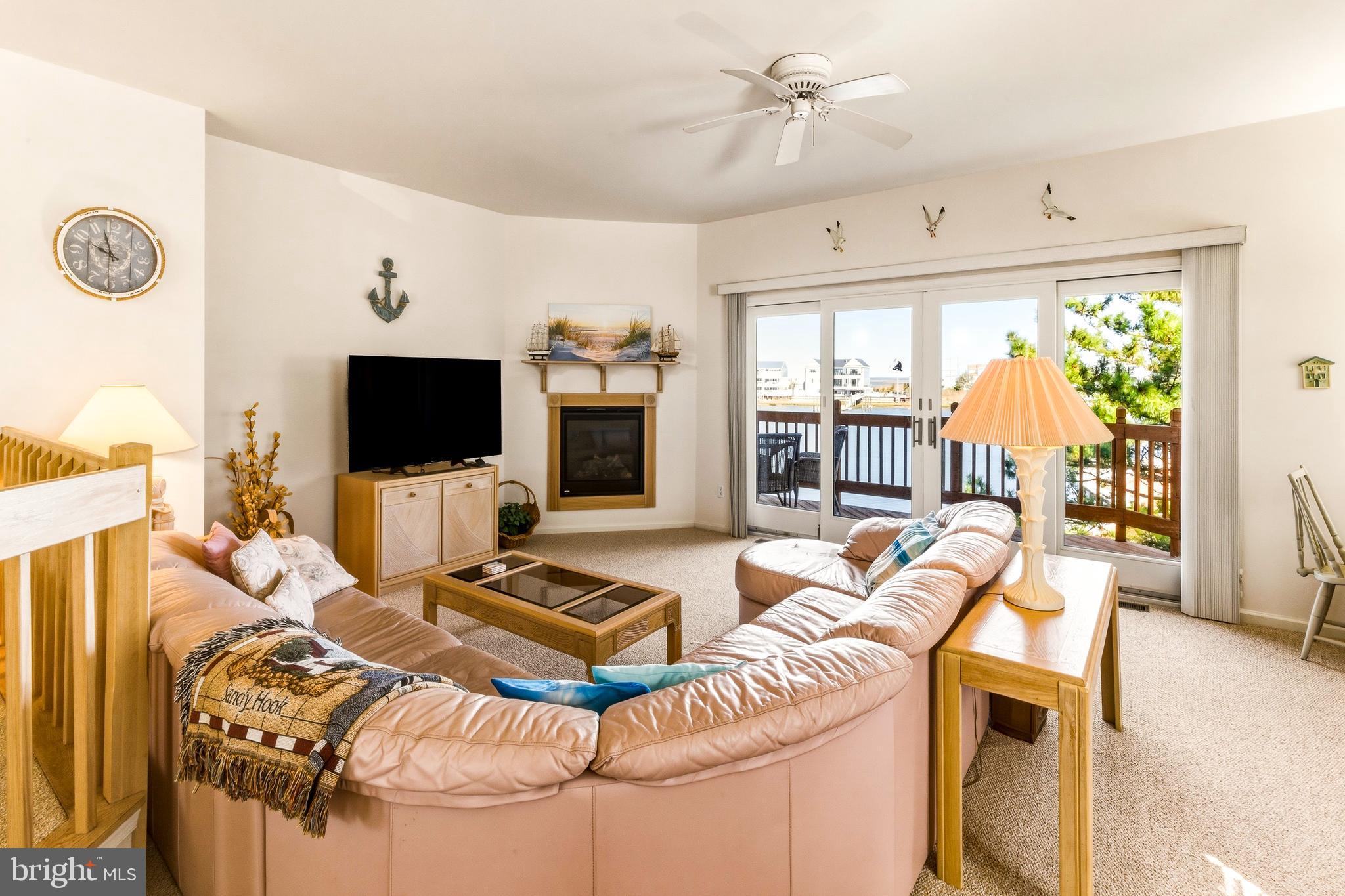301 Gull Cove Brigantine, NJ 08203 - Photo 21 of 40 a living room with furniture and a flat screen tv