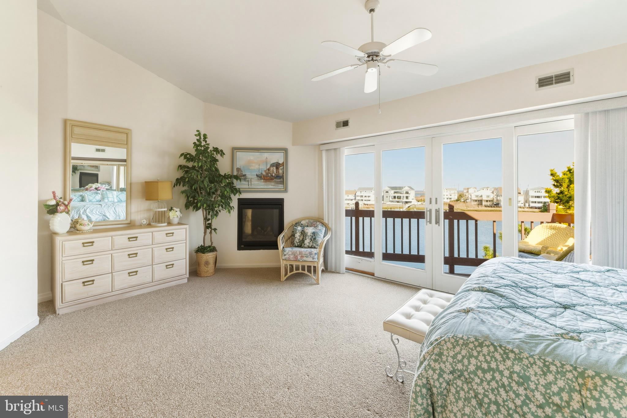 301 Gull Cove Brigantine, NJ 08203 - Photo 26 of 40 a bedroom with furniture and a fireplace