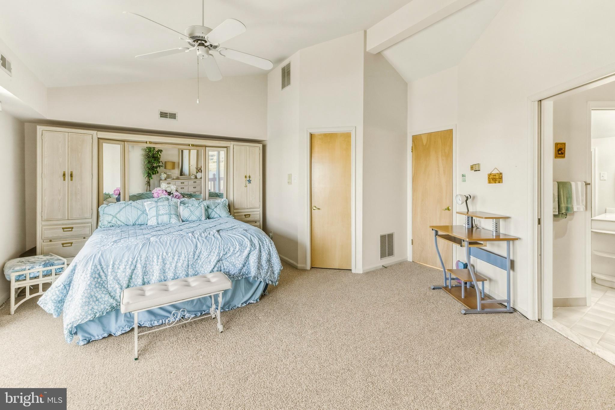 301 Gull Cove Brigantine, NJ 08203 - Photo 28 of 40 a bedroom with a bed and large mirror