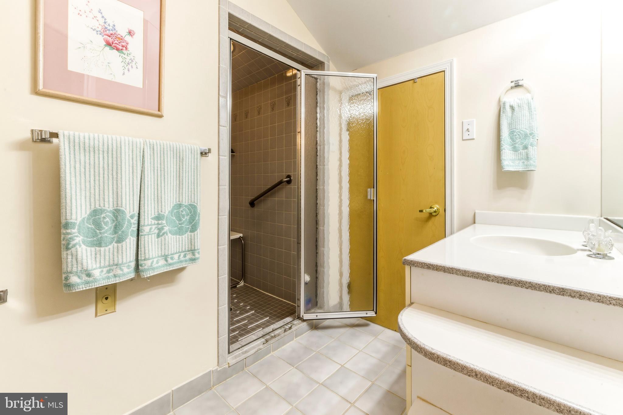 301 Gull Cove Brigantine, NJ 08203 - Photo 34 of 40 a bathroom with a granite countertop sink a toilet and shower