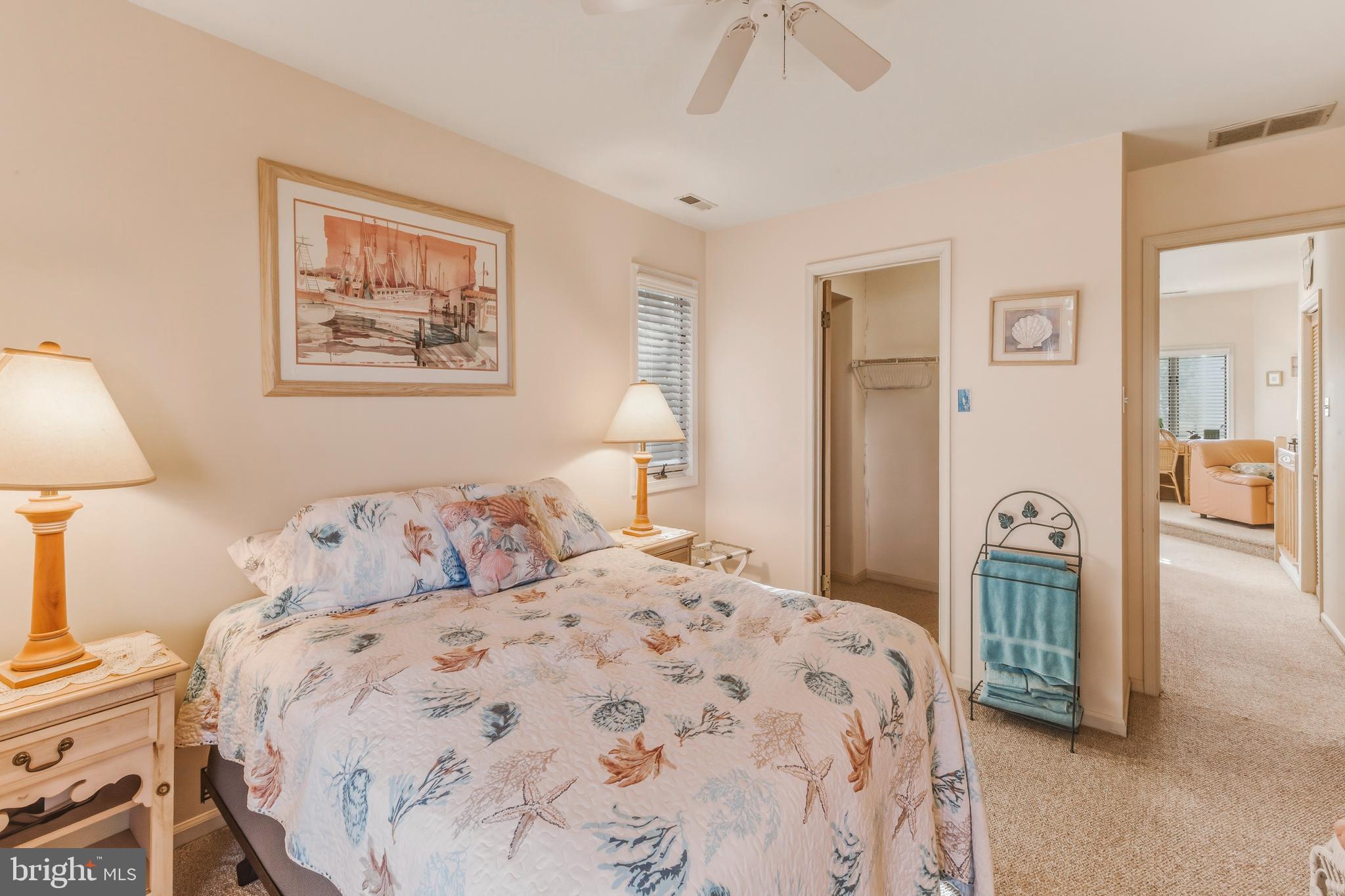 301 Gull Cove Brigantine, NJ 08203 - Photo 7 of 40 a bedroom with a bed and a lamp