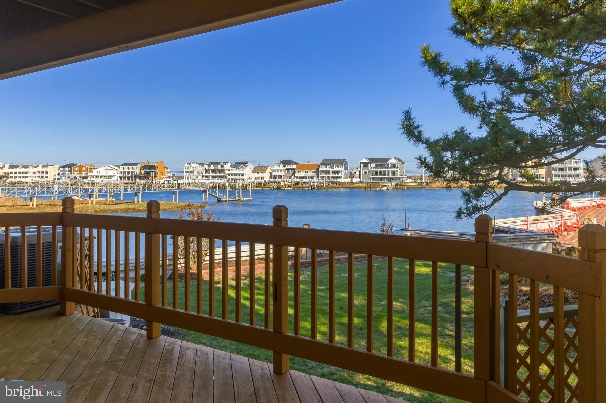 301 Gull Cove Brigantine, NJ 08203 - Photo 8 of 40 a view of a balcony with wooden floor & fence