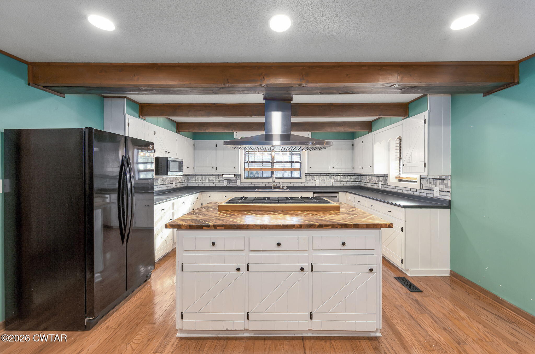 250 Collins Road Dresden, TN 38225 - Photo 13 of 43 a kitchen with stainless steel appliances granite countertop a refrigerator a sink and a stove