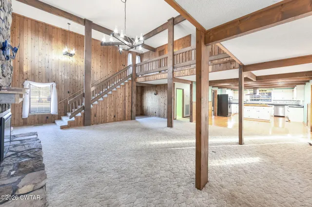 a view of a hallway with a building and stairs