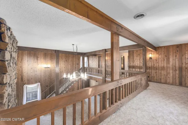 a large kitchen with stainless steel appliances granite countertop a refrigerator and a sink