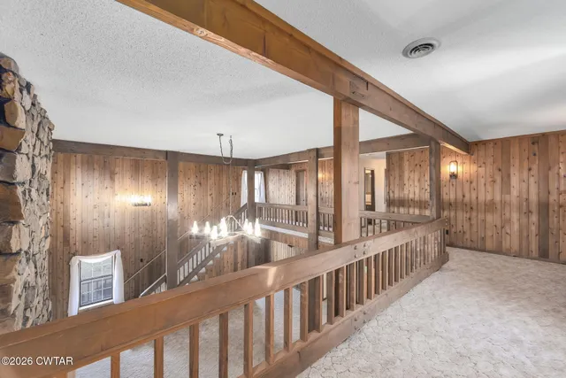 a large kitchen with stainless steel appliances granite countertop a refrigerator and a sink