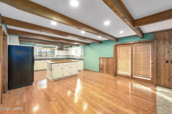 a bathroom with a sink shower and a mirror