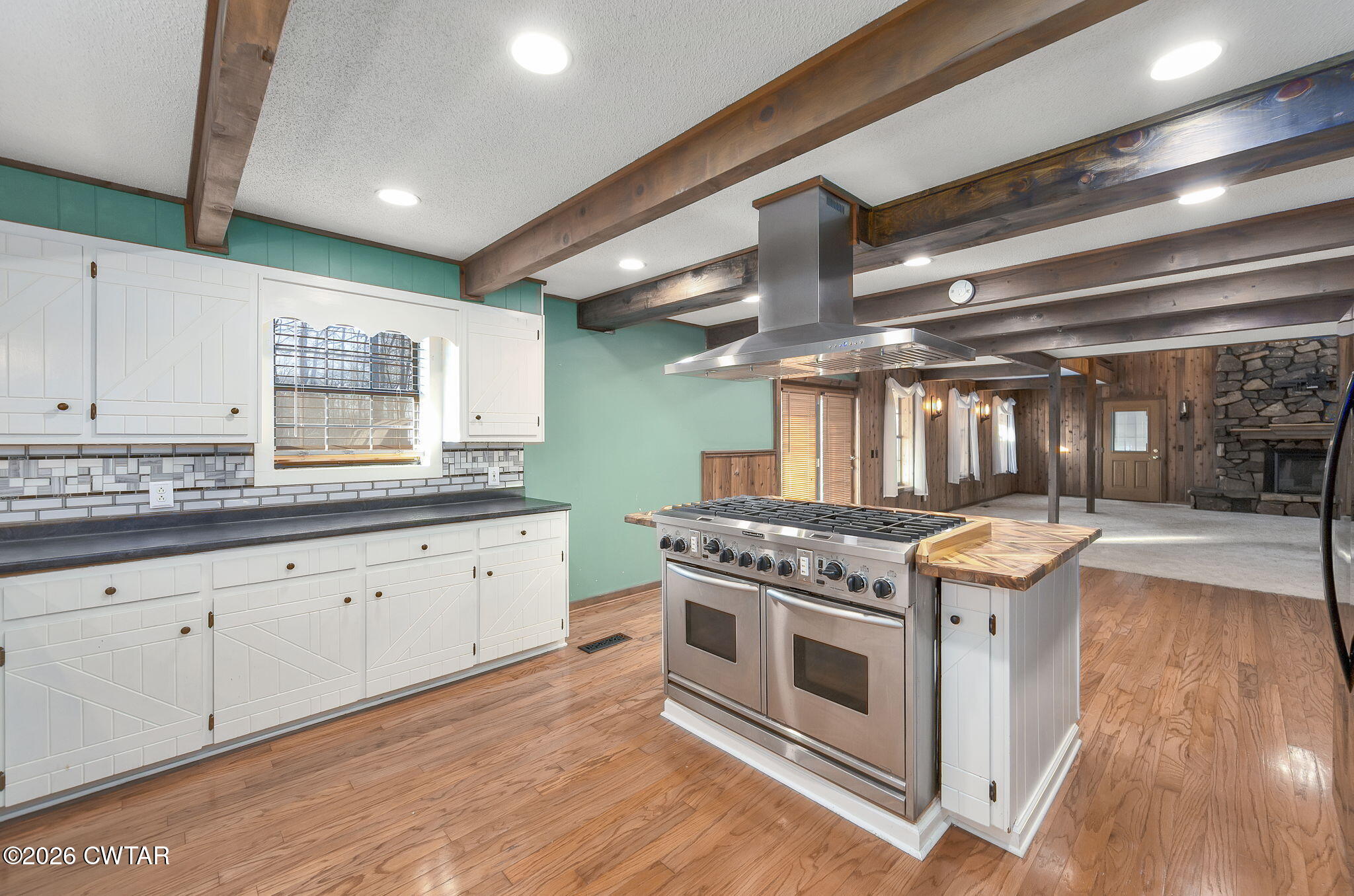 250 Collins Road Dresden, TN 38225 - Photo 25 of 43 a kitchen with stainless steel appliances granite countertop a stove and a sink