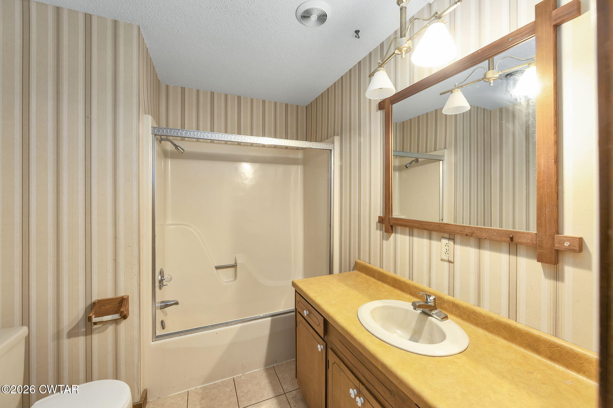 250 Collins Road Dresden, TN 38225 - Photo 26 of 43 a bathroom with a sink shower and a mirror