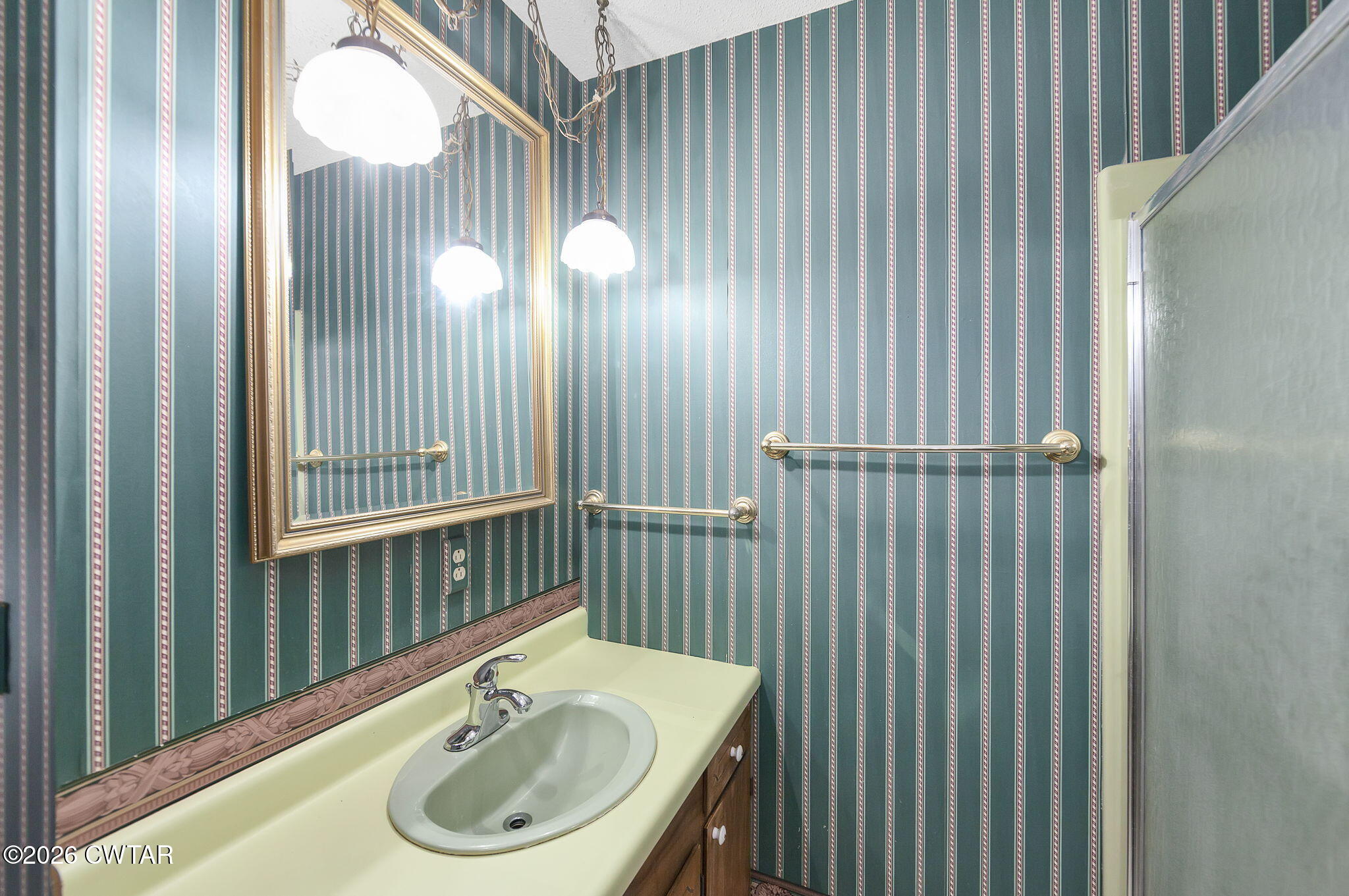 250 Collins Road Dresden, TN 38225 - Photo 28 of 43 a bathroom with a sink and a mirror