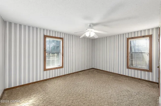 an empty room with windows