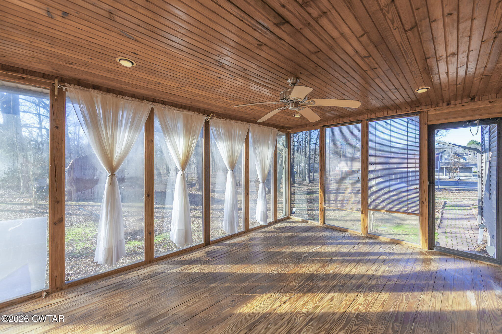 250 Collins Road Dresden, TN 38225 - Photo 10 of 43 a view of an empty room with wooden floor and a window