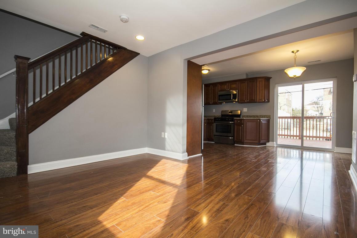 33 Eastship Road Baltimore, MD 21222 - Photo 1 of 23 a view of empty room with wooden floor and fan