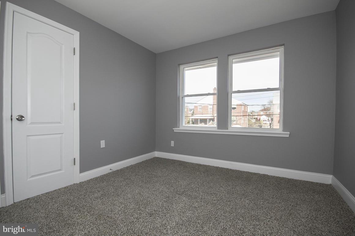 33 Eastship Road Baltimore, MD 21222 - Photo 11 of 23 wooden floor and window in an empty room