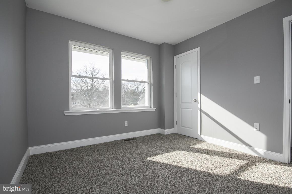 33 Eastship Road Baltimore, MD 21222 - Photo 12 of 23 a view of an empty room with a window