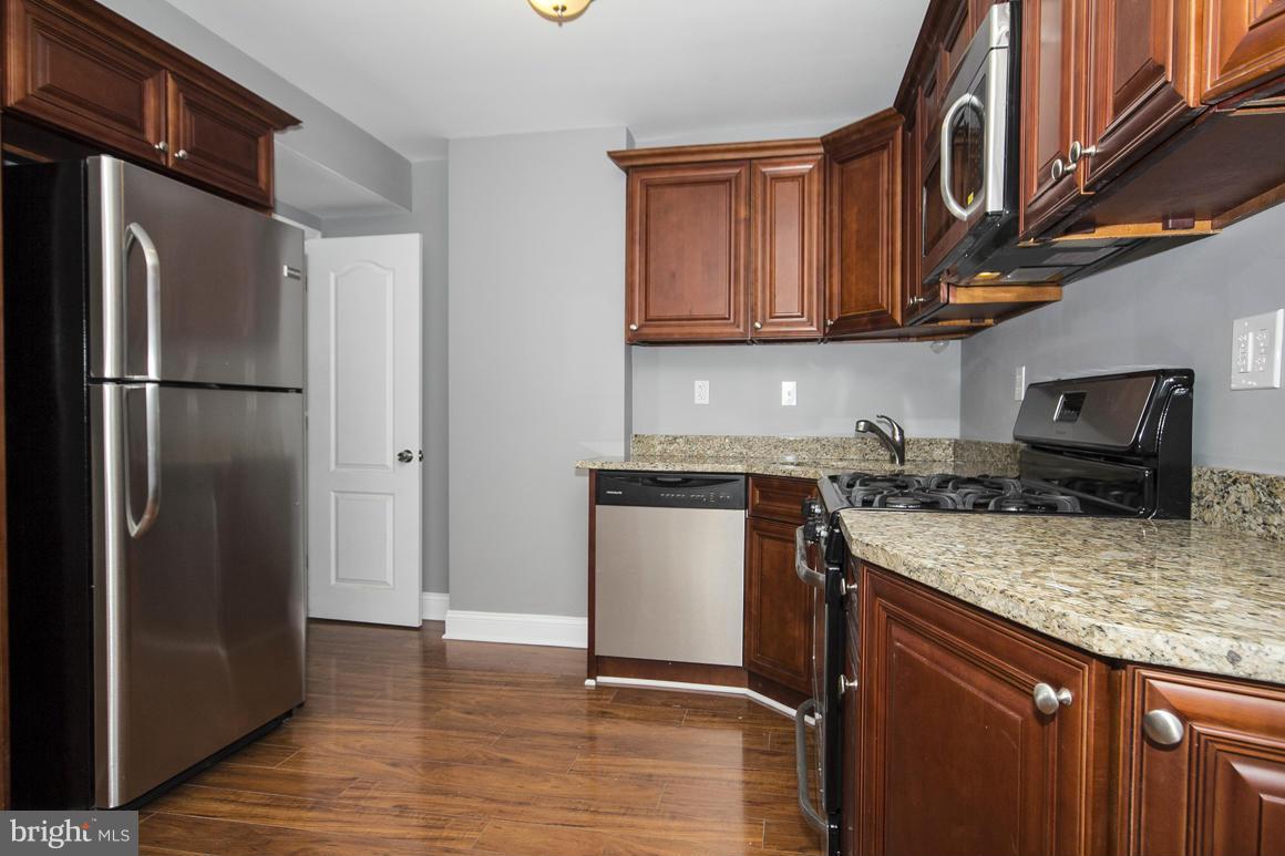 33 Eastship Road Baltimore, MD 21222 - Photo 5 of 23 a kitchen with a refrigerator sink and cabinets