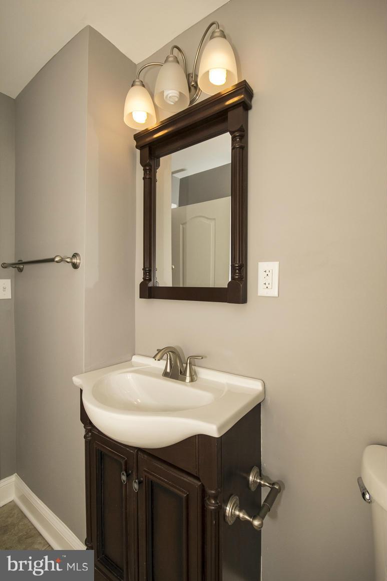 33 Eastship Road Baltimore, MD 21222 - Photo 9 of 23 a bathroom with a sink and a mirror