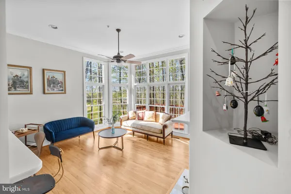 a kitchen with stainless steel appliances granite countertop wooden cabinets a sink and a microwave
