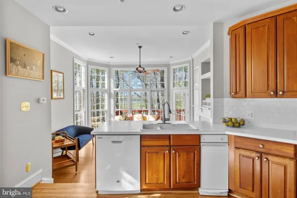 a spacious bathroom with a granite countertop tub sink and mirror