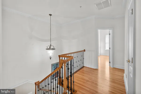a view of a livingroom with wooden floor and a window