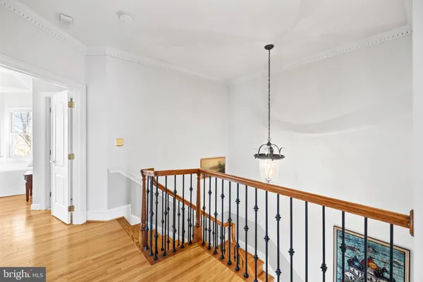 a view of balcony with wooden floor and fence