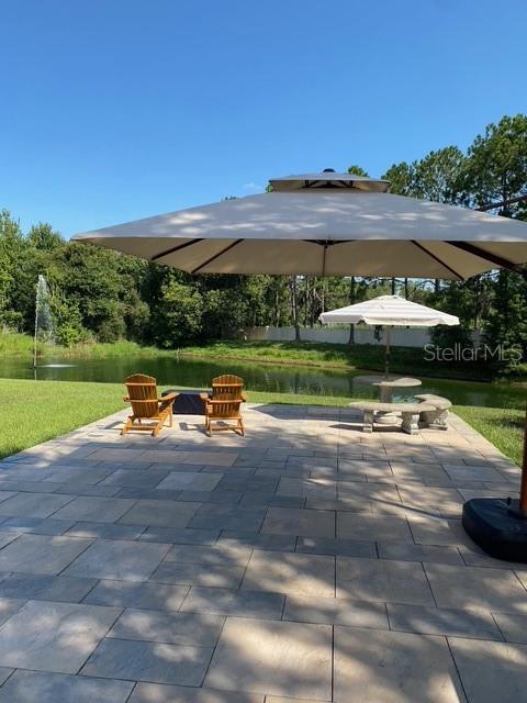 1141 Motorcoach Drive Polk City, FL 33868 - Photo 4 of 4 a view of yard with swimming pool and green space