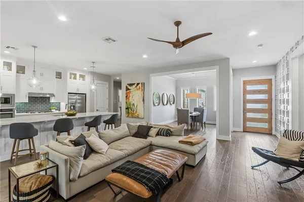 a living room with furniture and a large window