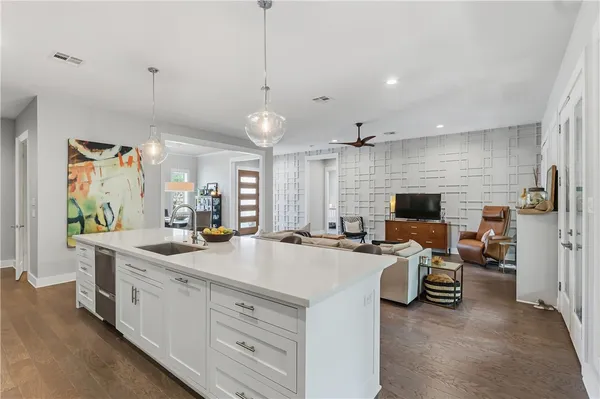 wooden floor in a room with a white cabinet