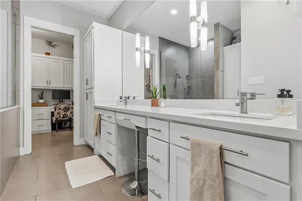 a white toilet sitting next to a bathroom sink
