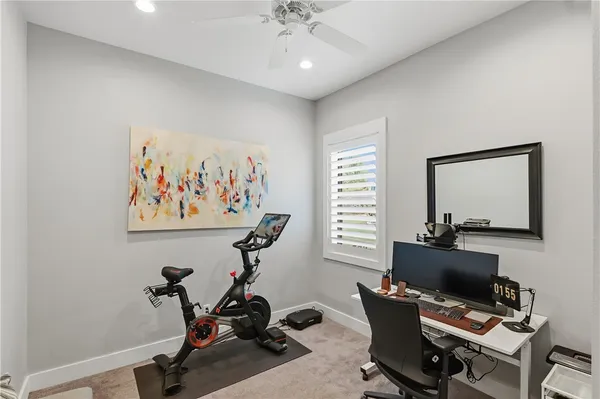 a view of a patio with a table and chairs