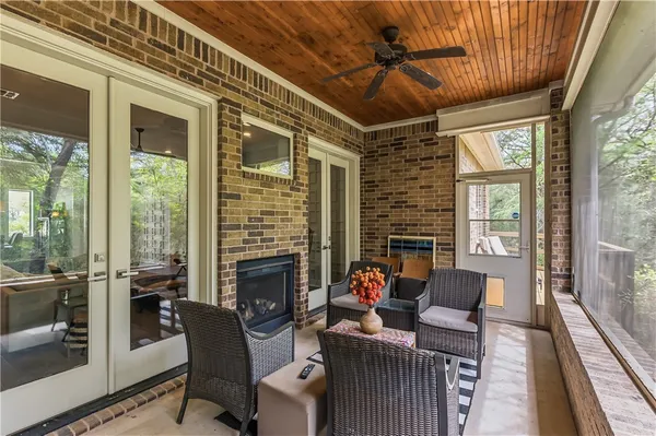 a outdoor living space with patio furniture and a fireplace