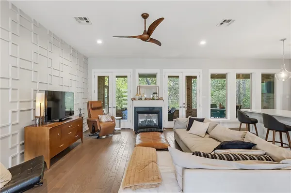 a living room with furniture fireplace and flat screen tv