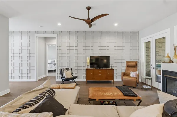 a living room with furniture and a flat screen tv