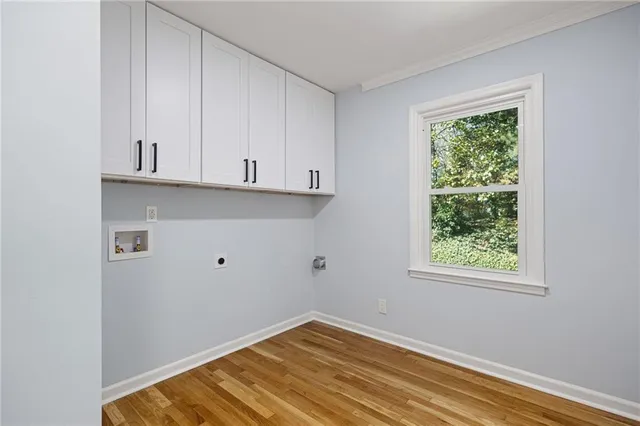 a view of empty room with window and entryway