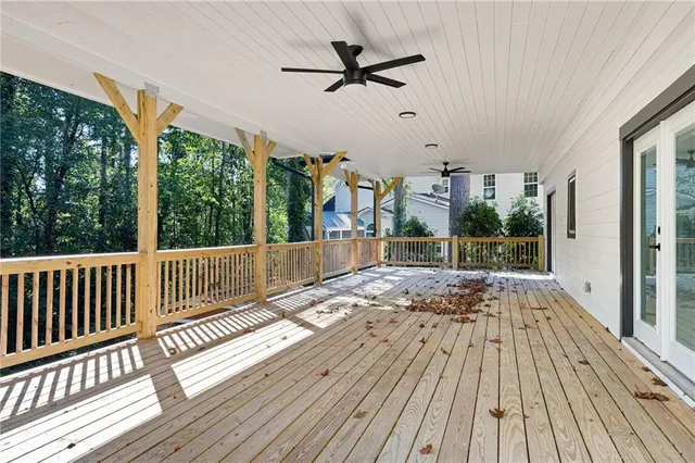 a view of a patio with wooden floor
