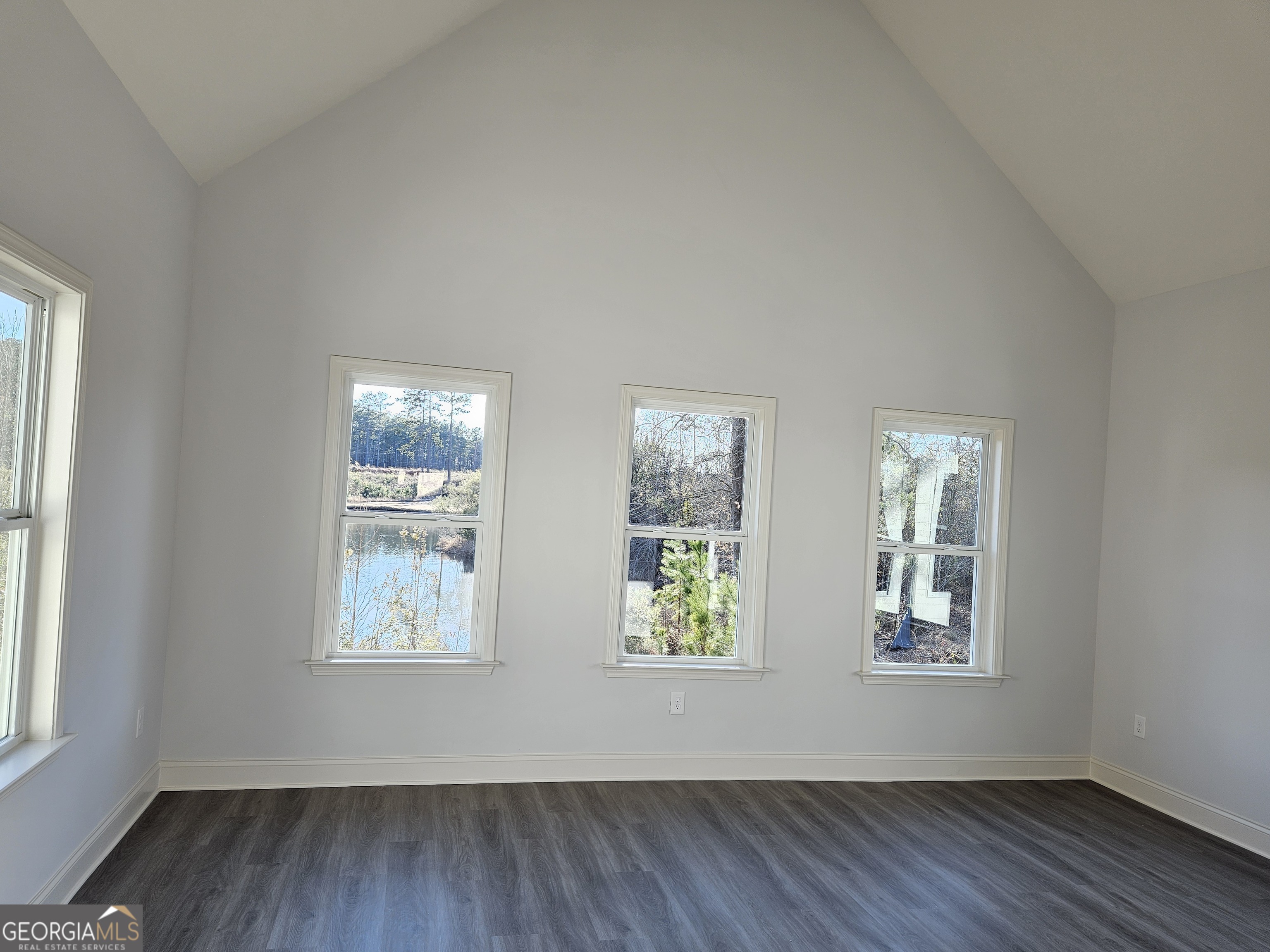 208 Trellis Walk Macon, GA 31220 - Photo 19 of 30 an empty room with wooden floor and windows